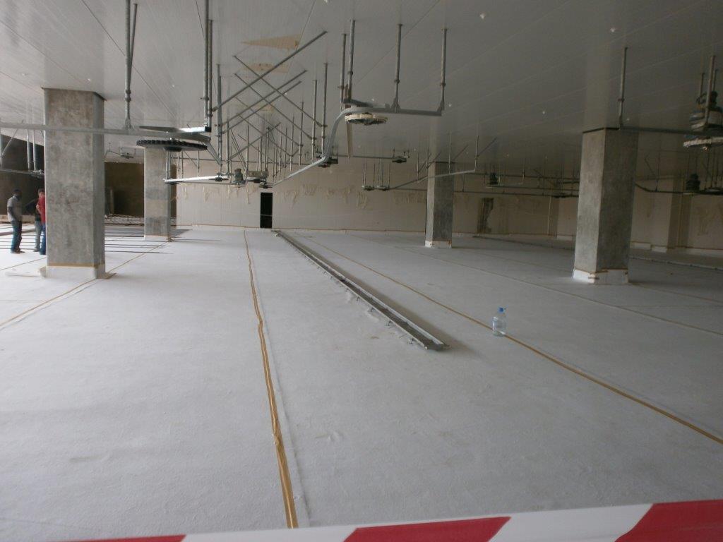 OzFlow stainless steel drain channel installed in food facility
